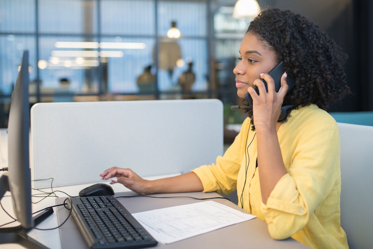 Student speaking with college staff member over the phone. Photo by Kampus Production on Pexels.com.