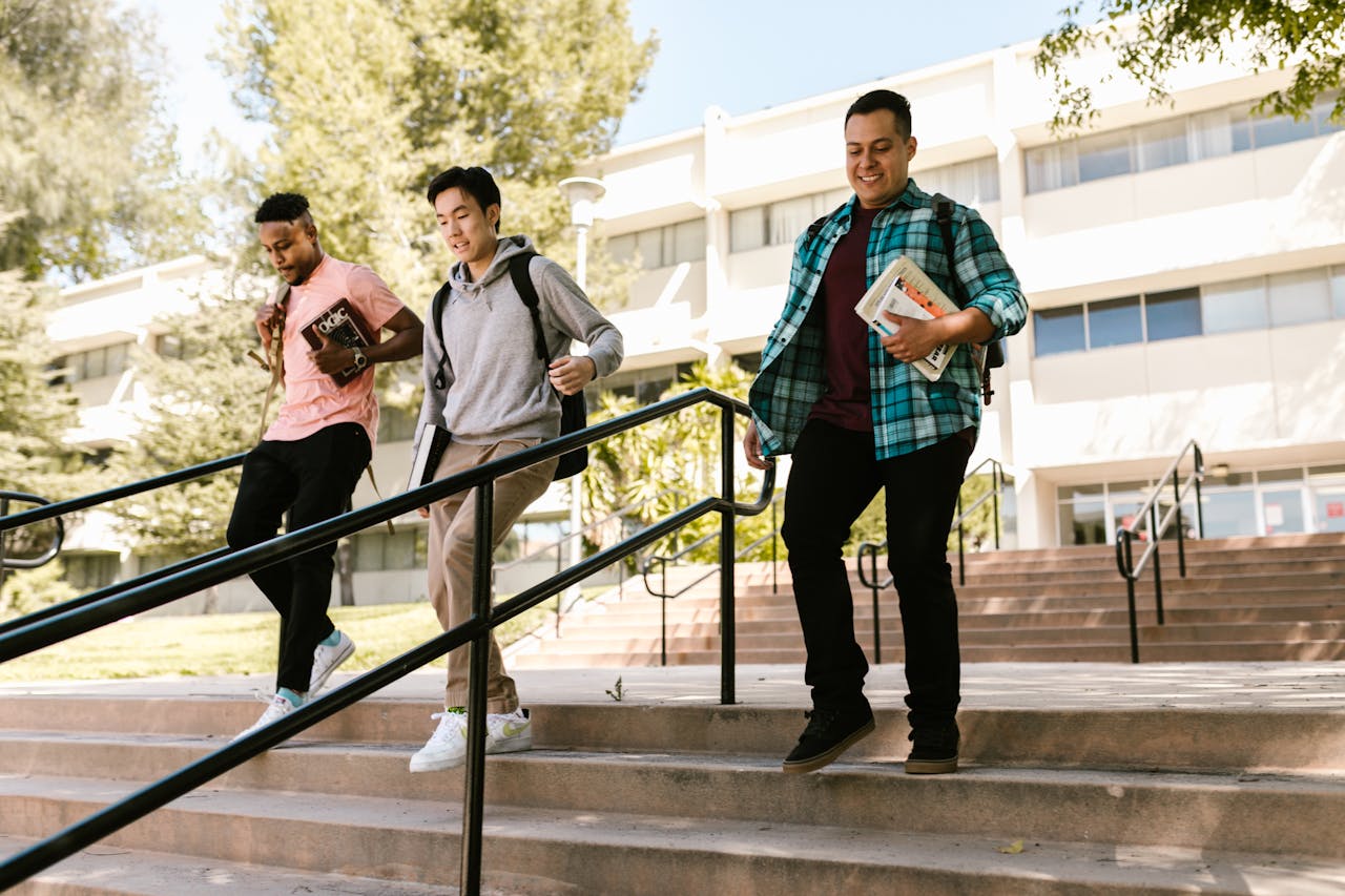 Students talking together on campus. Photo by RDNE Stock project on Pexels.com.